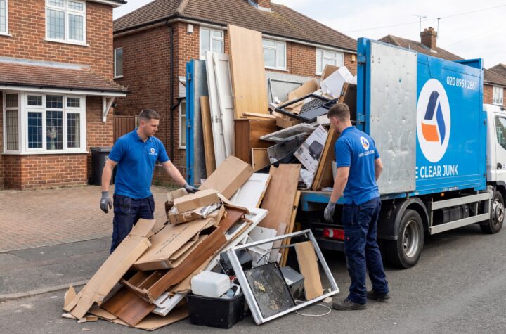 Man and van hire London team loading a full van of household waste