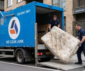 We Clear Junk team loading old mattress onto removal truck at London loading bay